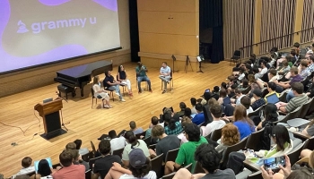 Wide shot of panel discussion in lecture hall