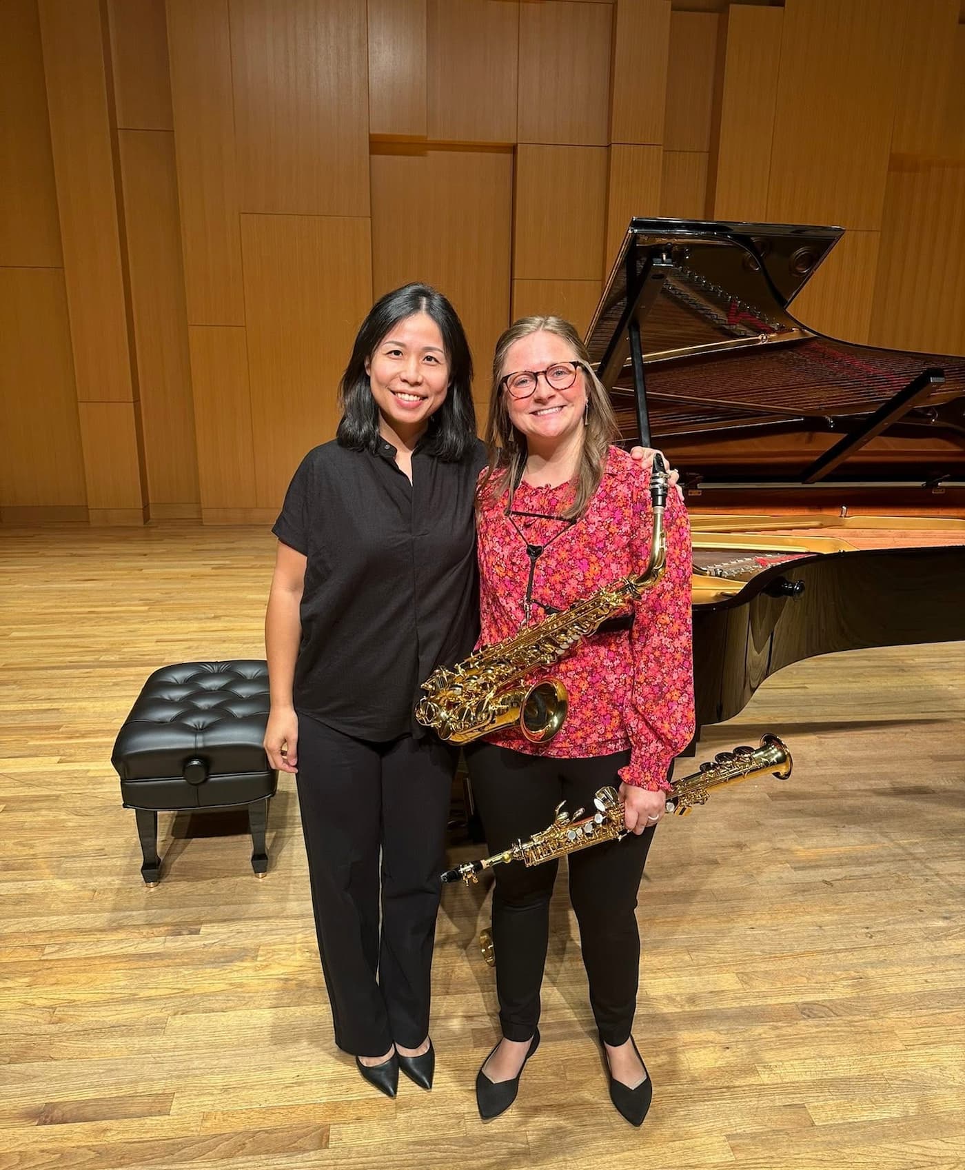 Dr. Peterson and Dr. Wang pose for a photo after their faculty recital