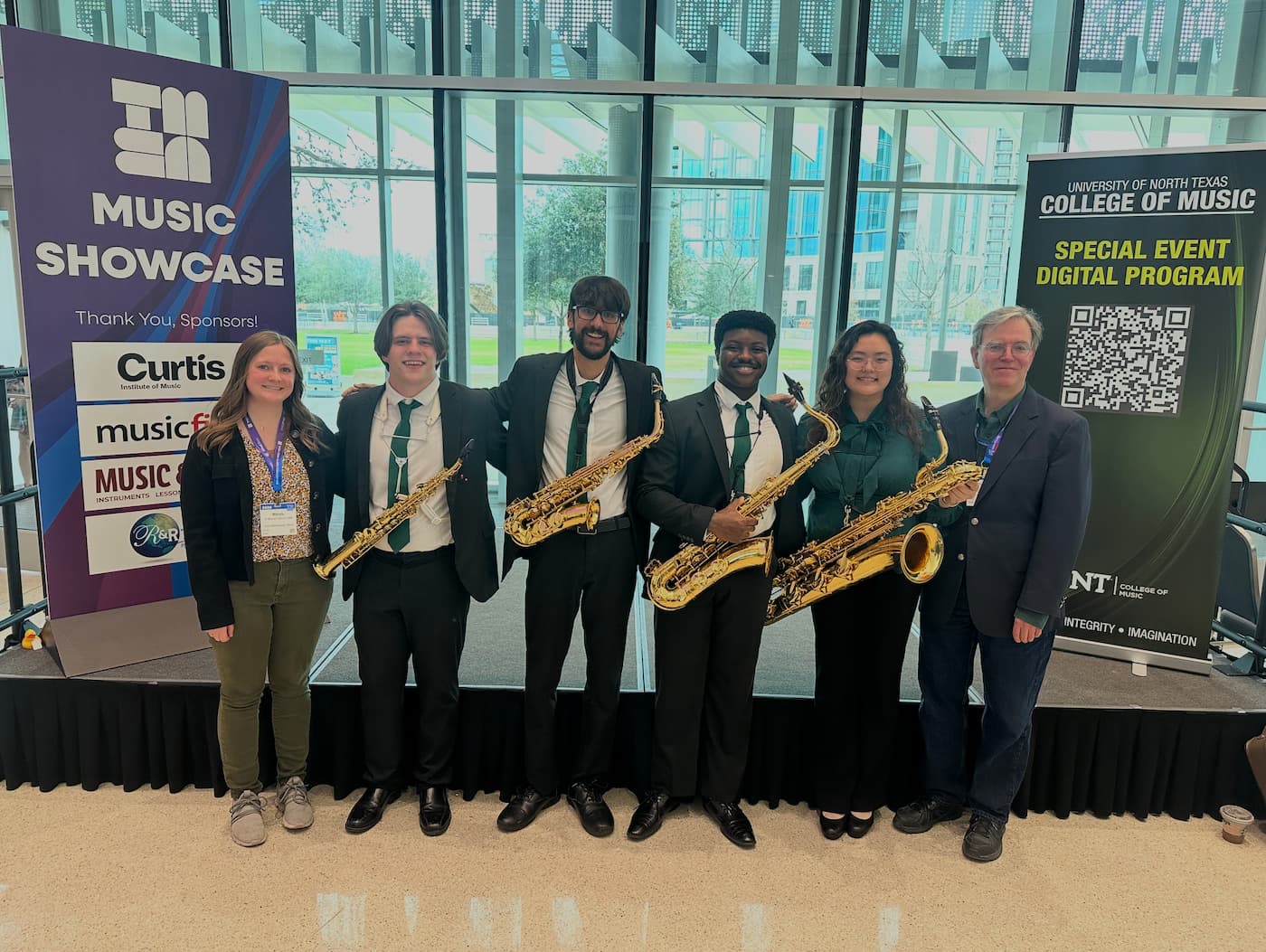 The Myriad Quartet poses with Dr. Nestler and Dr. Peterson at the Texas Music Educators Assocation Conference