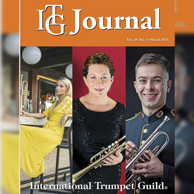 The image shows three individuals on the magazine cover with Nathan to the right dressed in his gray military uniform trimmed in gold. He is holding his trumpet with both hands.