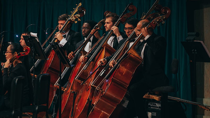 Bass players in tuxedos